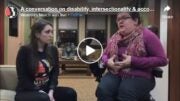 Photo of Emily Ladau discussing disability rights with the Women's March